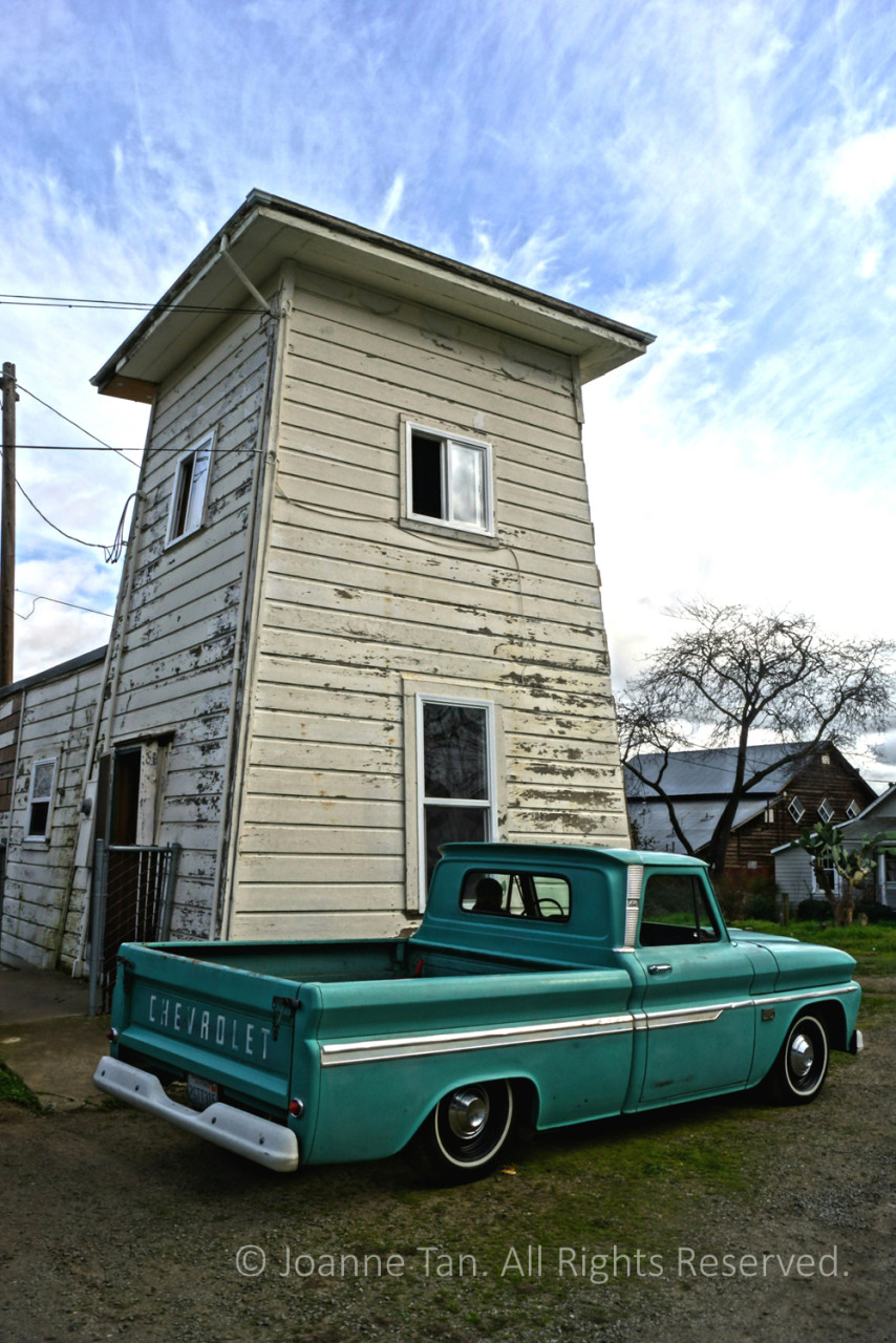 P-landscape- A Green Chevy Truck & an Old Building