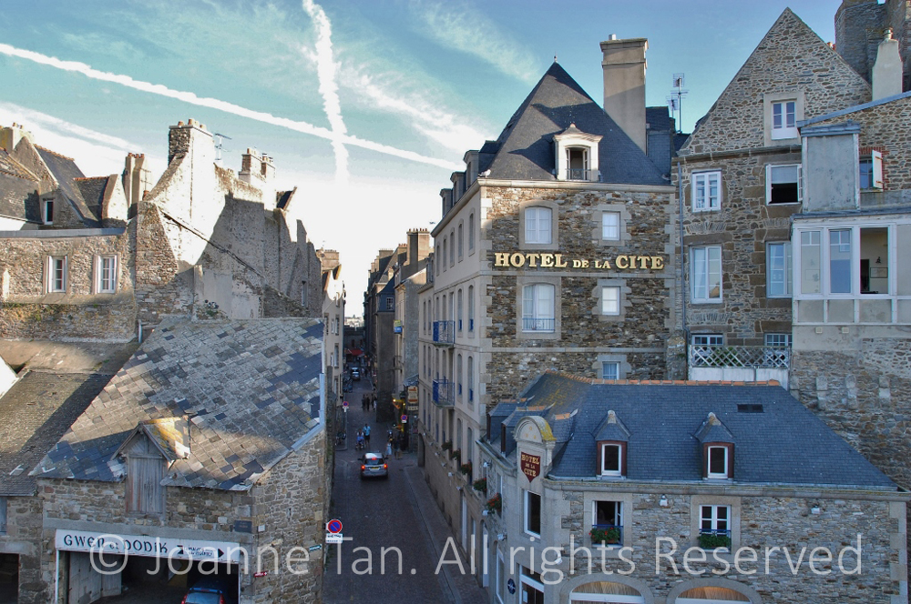 p- architecture - cityscape - street & French stone buildings - Hotel de la Cite - cross in the sky - St. Malo, Brittany, France, 1